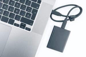 external hard disk connected to a modern laptop computer
