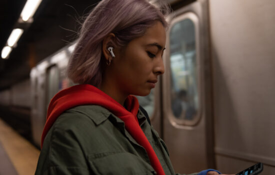 User listening to AirPods Pro on Subway Station