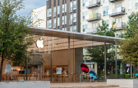 Apple Store with trees and cityscape.