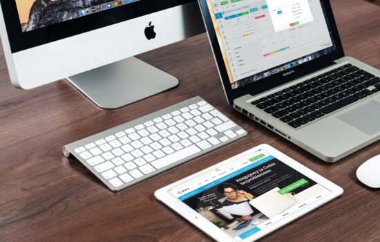 Apple devices on a desk.