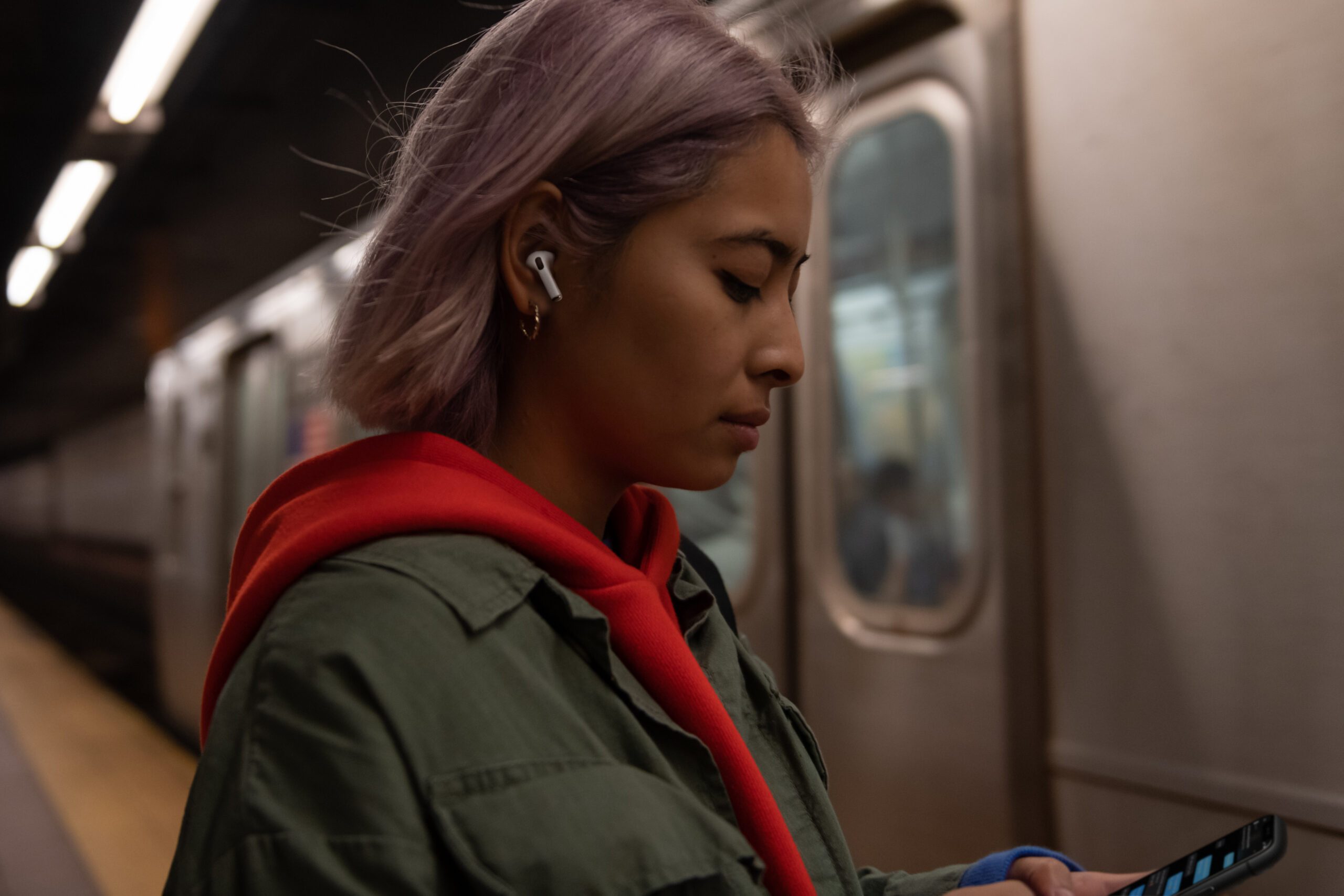 User listening to AirPods Pro on Subway Station