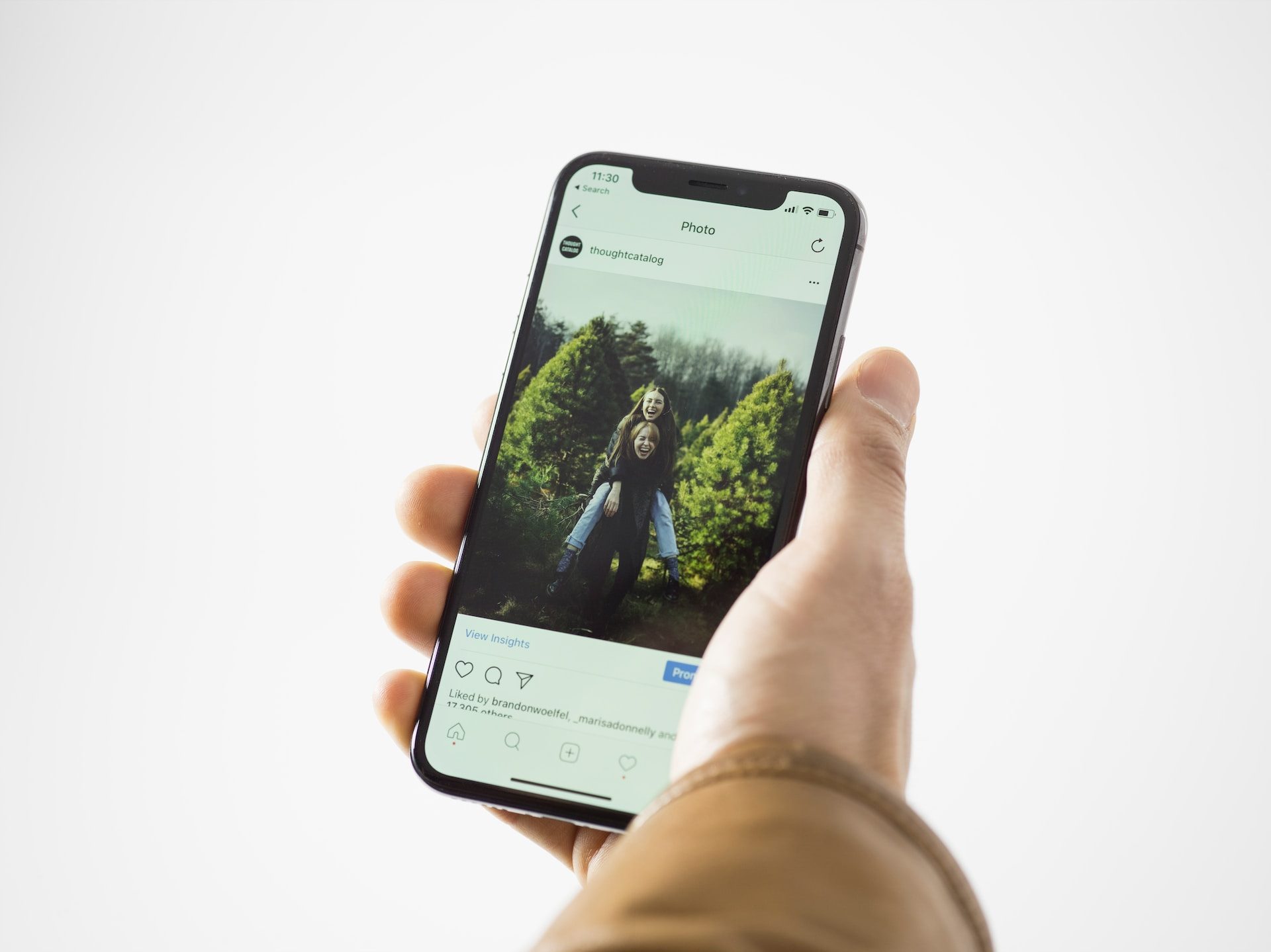 Person holding iPhone.