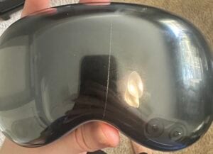 An Apple Vision Pro with a sliver in the front glass.